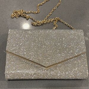 Elegant Silver Clutch with Gold Chain